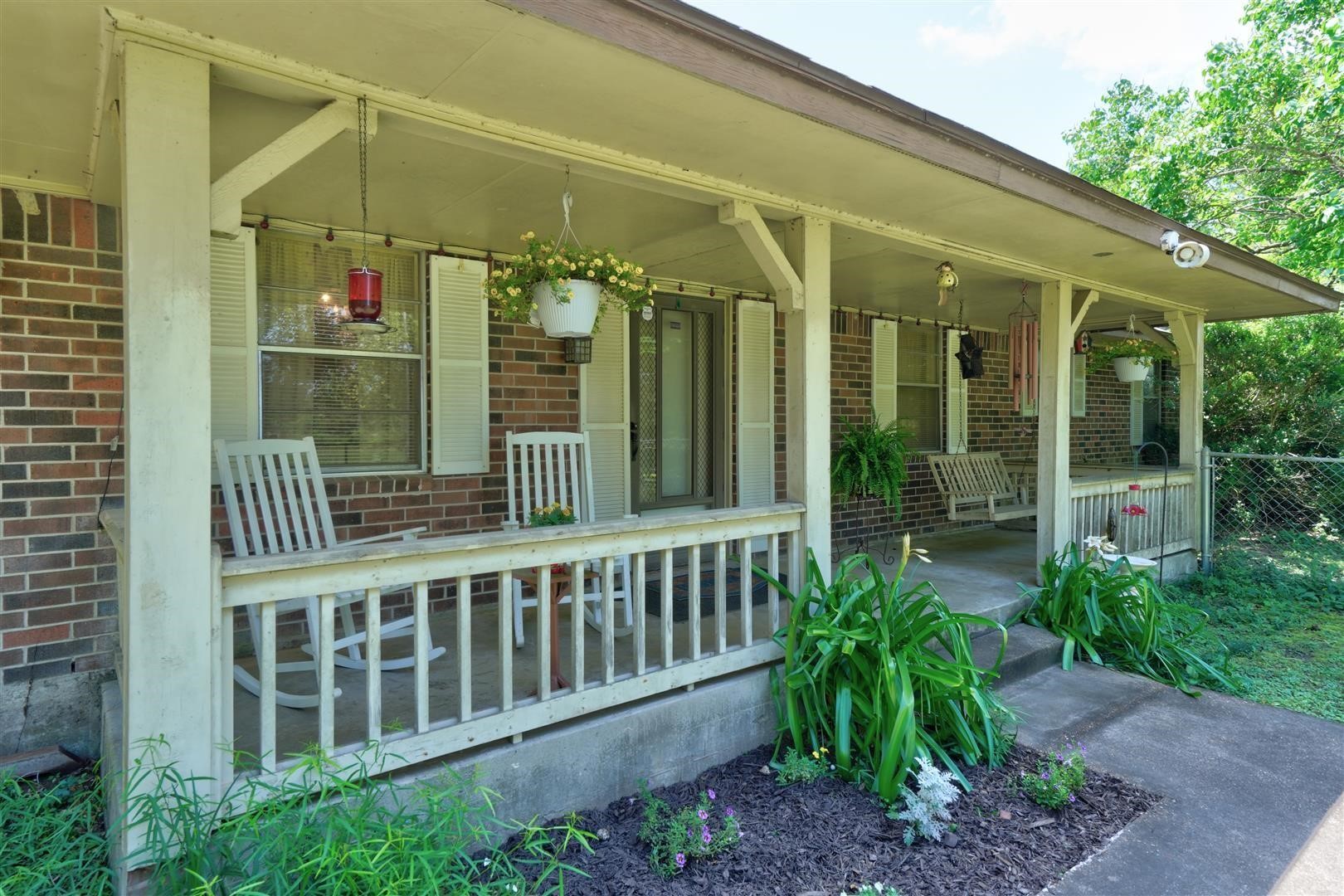 15771 1st Street Splendora, TX 77372 - Photo 5 of 47 a view of a chair and table in the patio