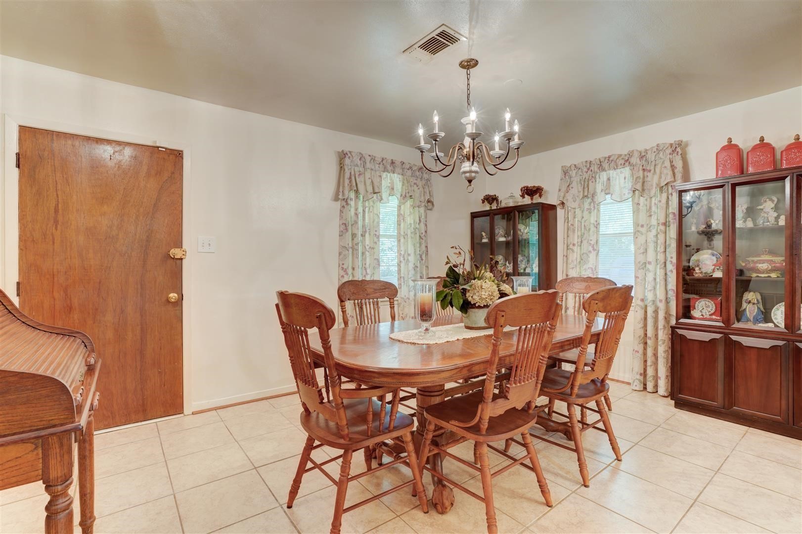 15771 1st Street Splendora, TX 77372 - Photo 6 of 47 a view of a dining room with furniture and window