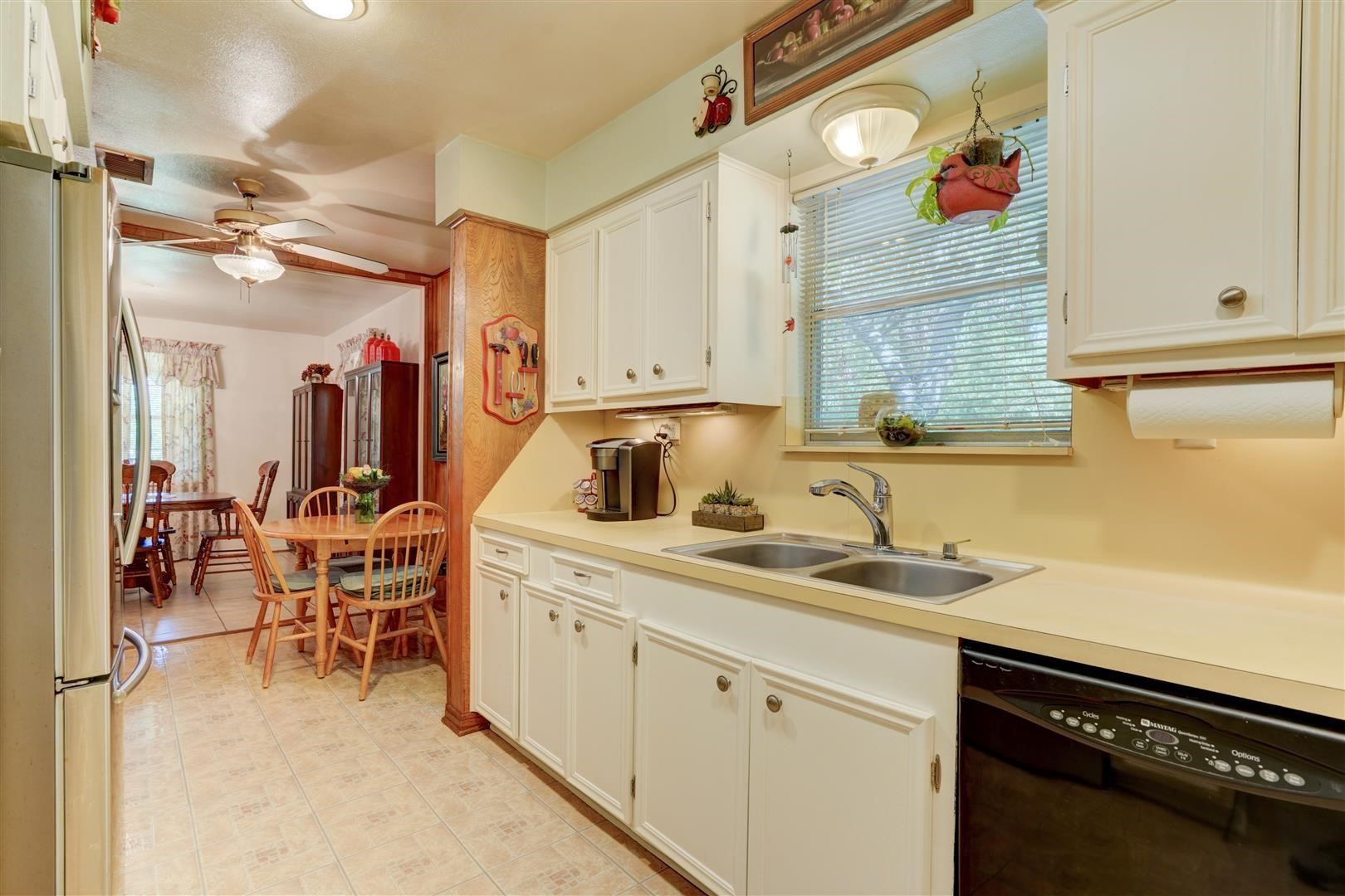 15771 1st Street Splendora, TX 77372 - Photo 10 of 47 a kitchen with a sink and cabinets