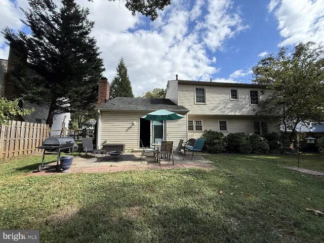 a front view of house with yard and outdoor seating