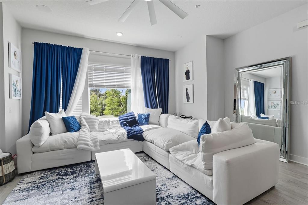2511 North Grady Avenue, Unit 34 Tampa, FL 33607 - Photo 11 of 45 a living room with furniture and a large window