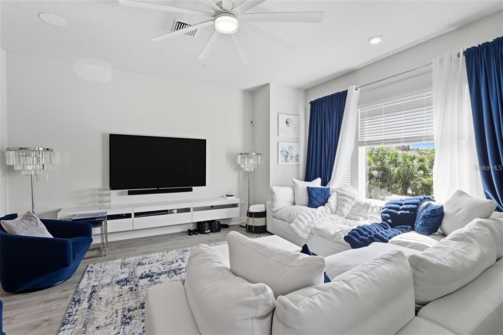 2511 North Grady Avenue, Unit 34 Tampa, FL 33607 - Photo 12 of 45 a living room with furniture and a flat screen tv