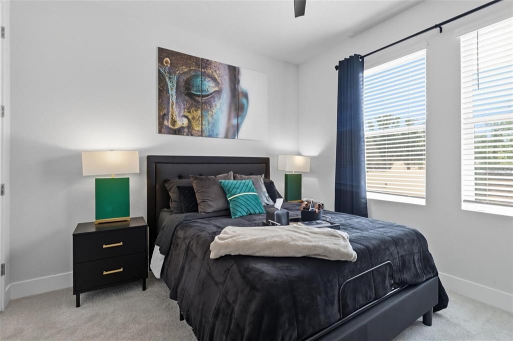 2511 North Grady Avenue, Unit 34 Tampa, FL 33607 - Photo 14 of 45 a bedroom with a bed and a fireplace