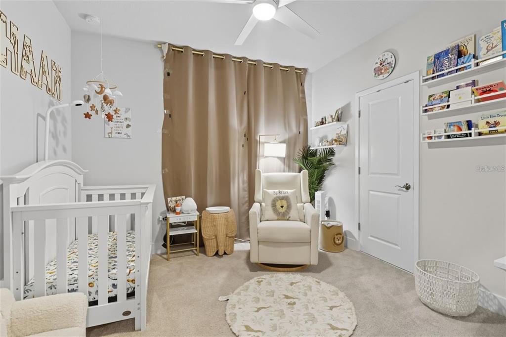 2511 North Grady Avenue, Unit 34 Tampa, FL 33607 - Photo 16 of 45 a living room with furniture and a large window