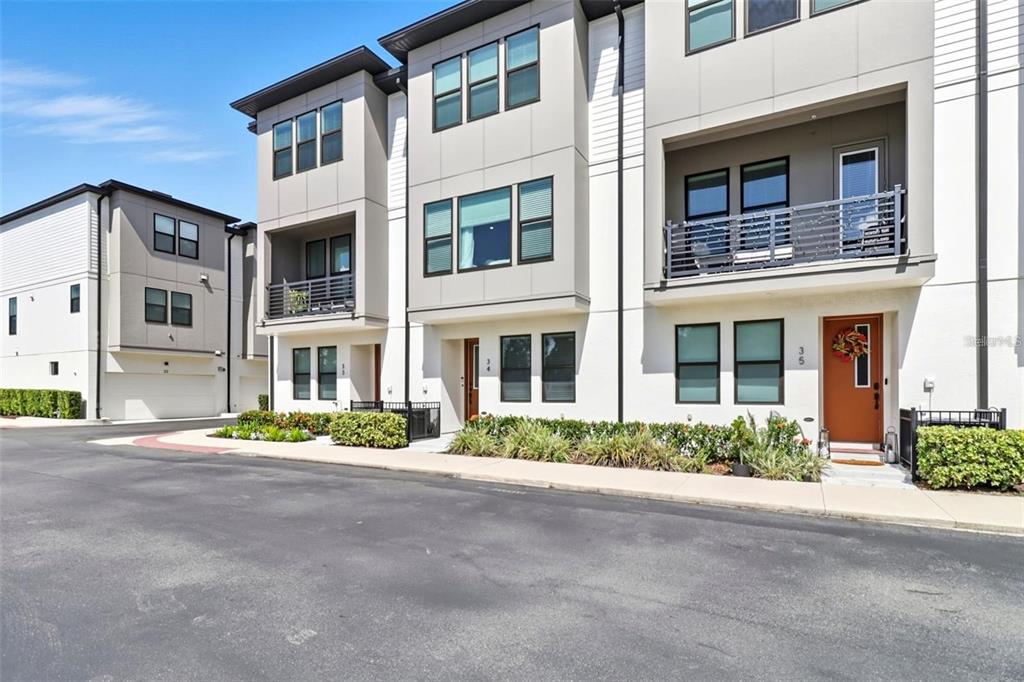 2511 North Grady Avenue, Unit 34 Tampa, FL 33607 - Photo 30 of 45 a front view of a building with a garden
