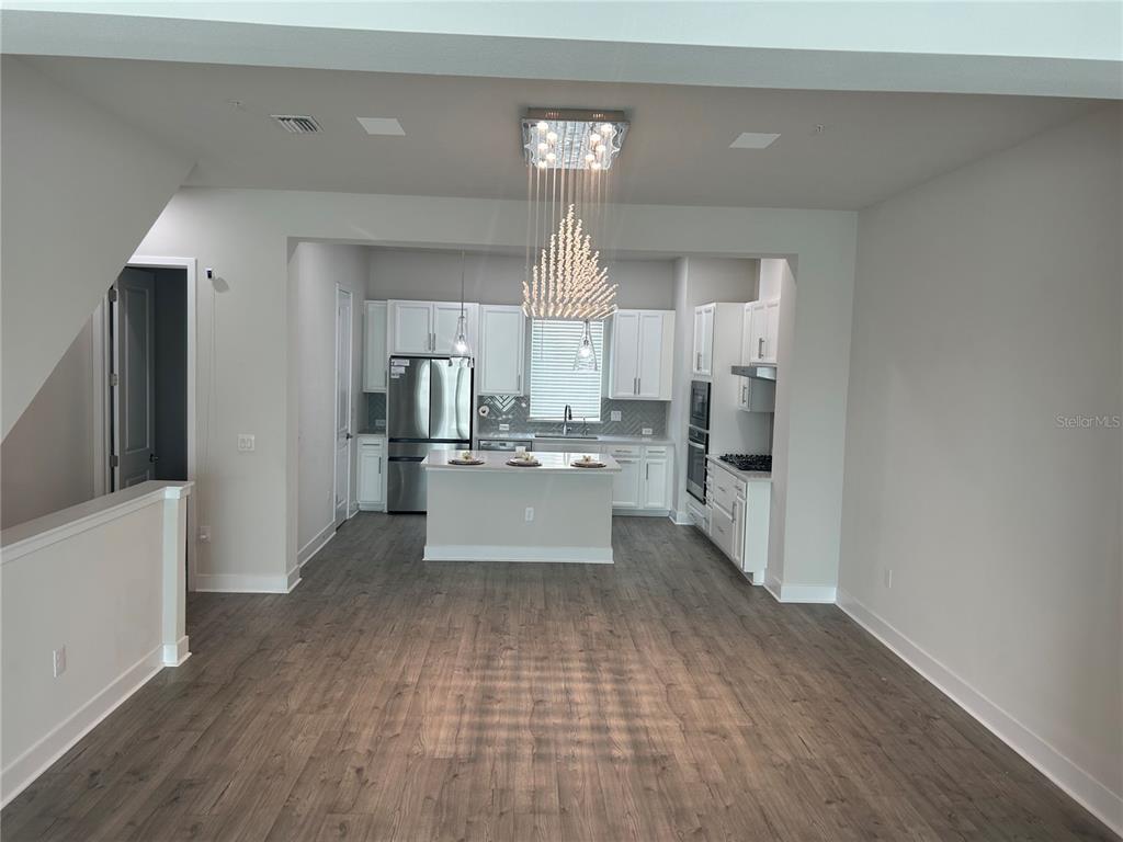 2511 North Grady Avenue, Unit 34 Tampa, FL 33607 - Photo 33 of 45 a view of a kitchen with cabinets and wooden floor