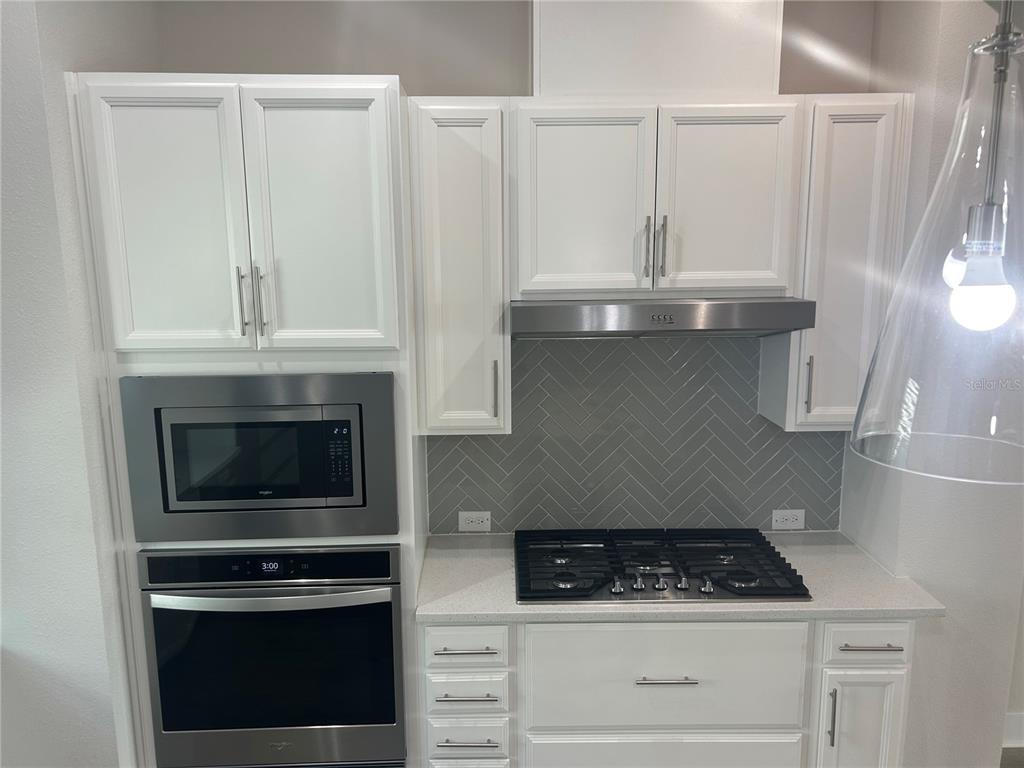 2511 North Grady Avenue, Unit 34 Tampa, FL 33607 - Photo 36 of 45 a kitchen with white cabinets and appliances