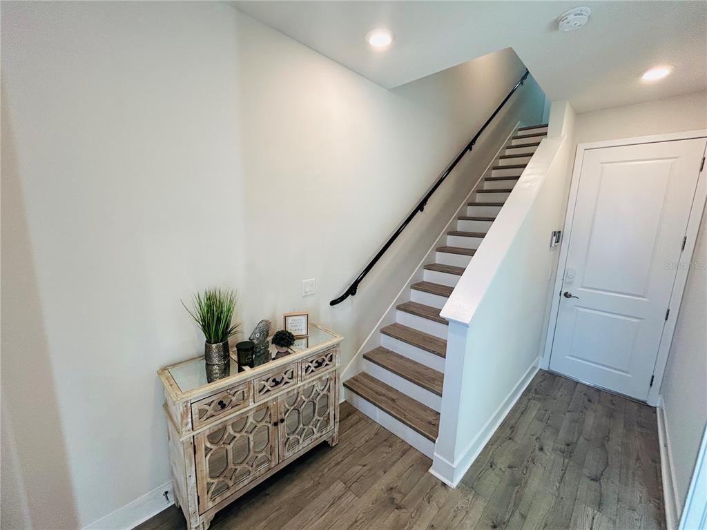 2511 North Grady Avenue, Unit 34 Tampa, FL 33607 - Photo 4 of 45 a view of entryway with stairs and wooden floor