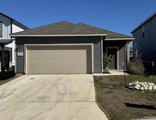a front view of a house with yard