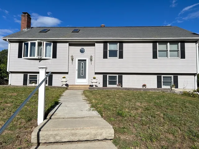 a front view of a house with a yard