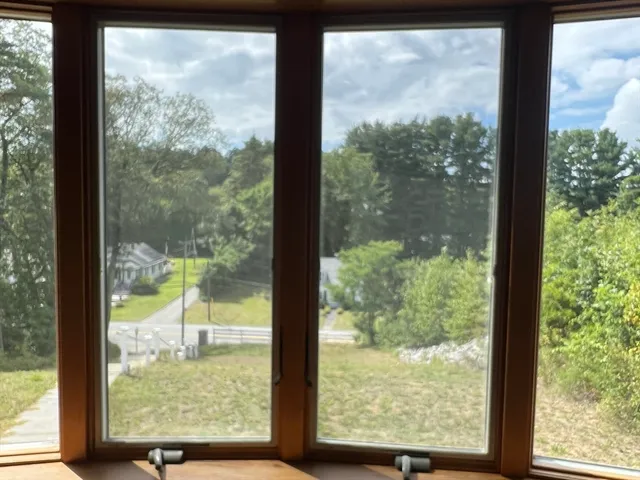 a kitchen with cabinets and chairs