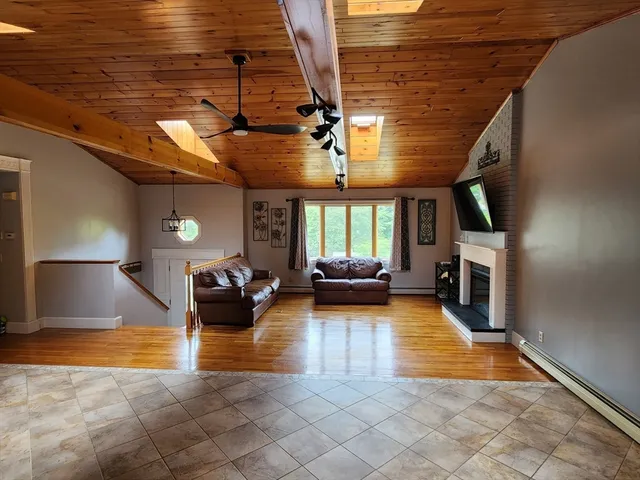 a room that has a bed and a window in it