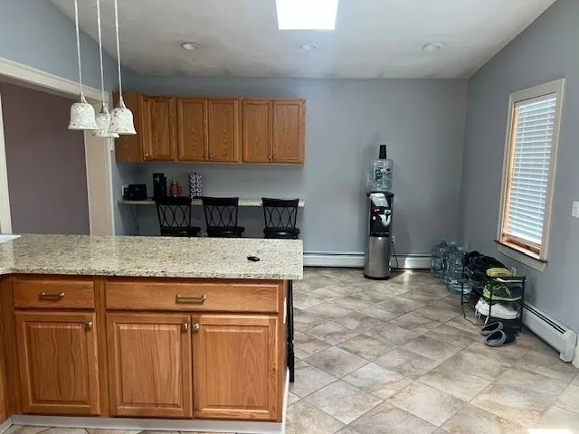 a view of a house with yard and sitting area