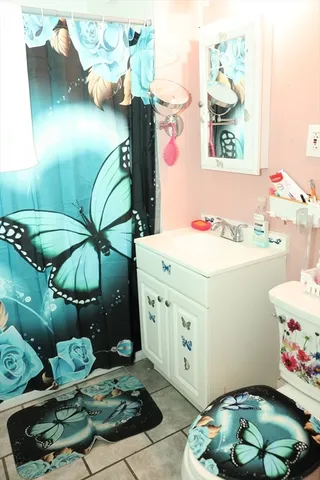 a kitchen with a refrigerator sink stove and cabinets