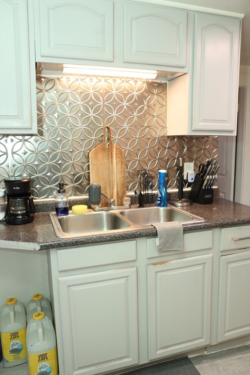 62-64 Whittier Street Springfield, MA 01108 - Photo 14 of 30 a kitchen with a sink and cabinets