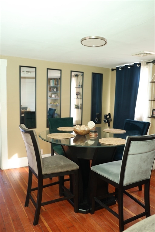62-64 Whittier Street Springfield, MA 01108 - Photo 21 of 30 a view of a dining room with furniture and wooden floor