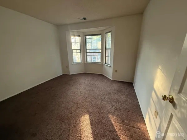 a view of a big room with windows