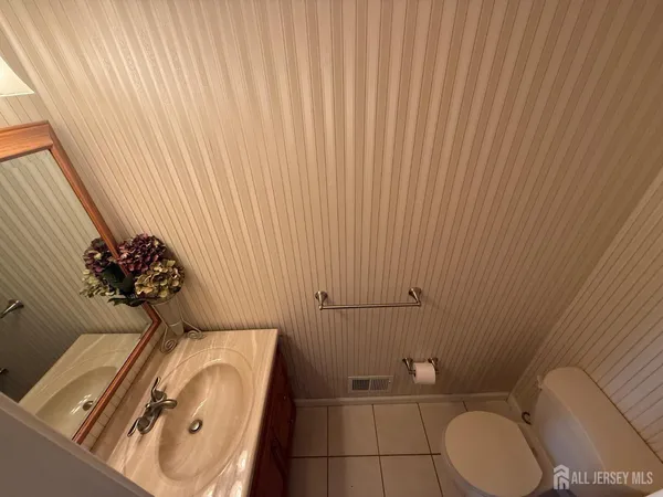 a bathroom with a toilet and a sink
