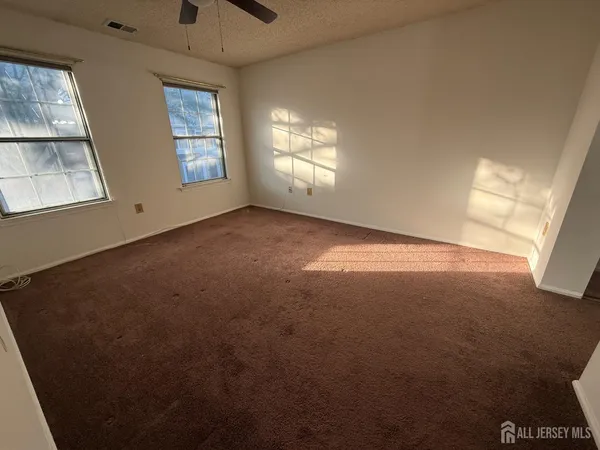 an empty room with windows