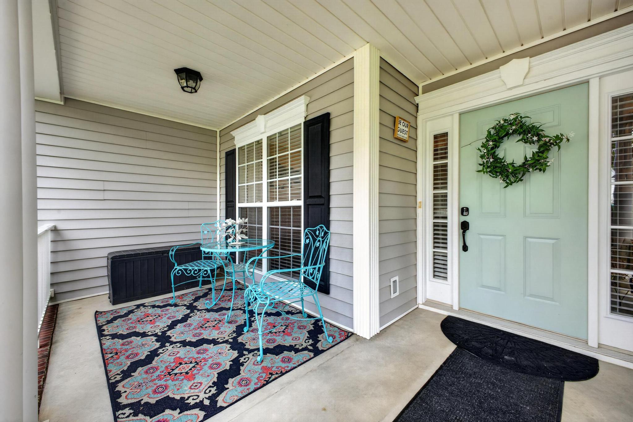 42 Emerald Ridge Aiken, SC 29803 - Photo 4 of 33 a view of a porch with furniture and floor to ceiling window