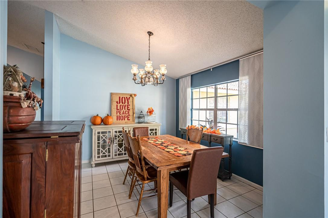 1315 Sabal Lakes Road Delray Beach, FL 33445 - Photo 11 of 38 a view of a dining room with furniture and window