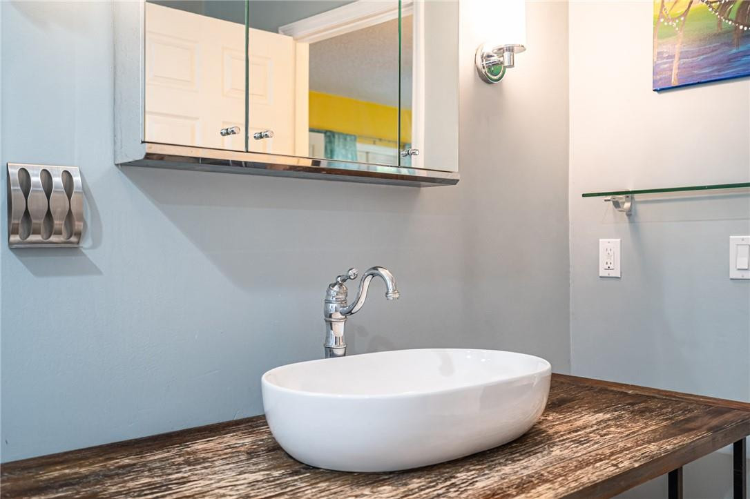1315 Sabal Lakes Road Delray Beach, FL 33445 - Photo 17 of 38 a bathroom with a sink and a window