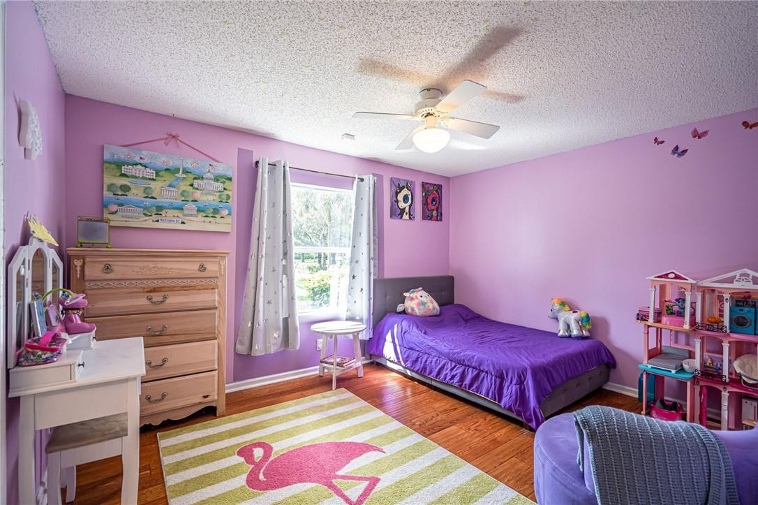 1315 Sabal Lakes Road Delray Beach, FL 33445 - Photo 18 of 38 a bedroom with a bed and a window