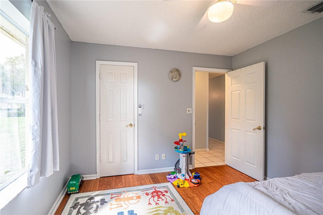 1315 Sabal Lakes Road Delray Beach, FL 33445 - Photo 21 of 38 a bed room with a bed and a window