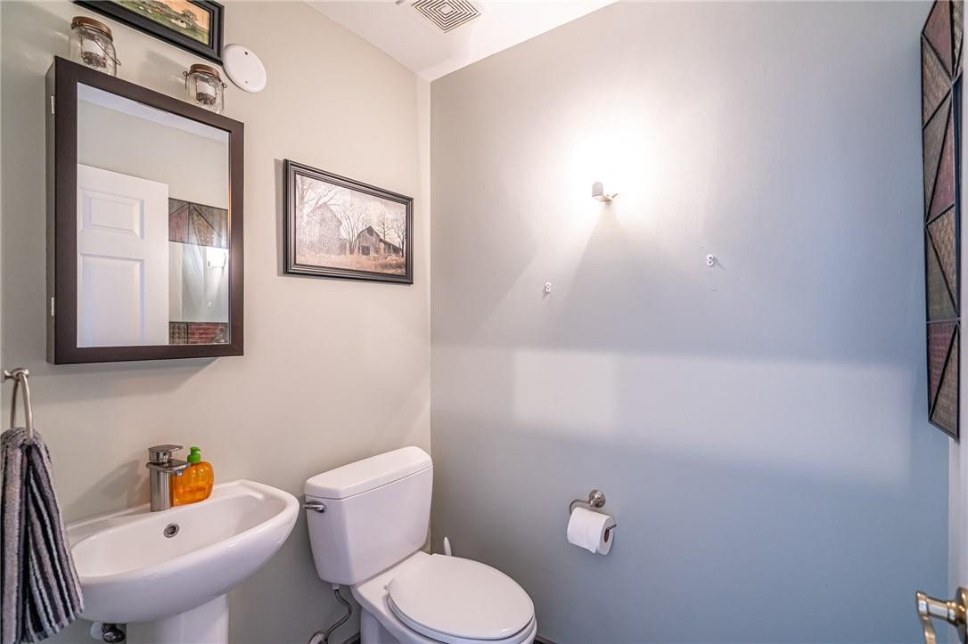 1315 Sabal Lakes Road Delray Beach, FL 33445 - Photo 25 of 38 a bathroom with a toilet sink and mirror