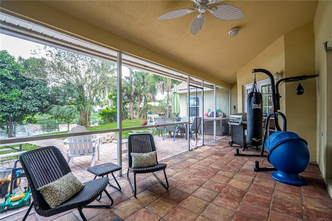 1315 Sabal Lakes Road Delray Beach, FL 33445 - Photo 26 of 38 a view of a livingroom with furniture and a porch