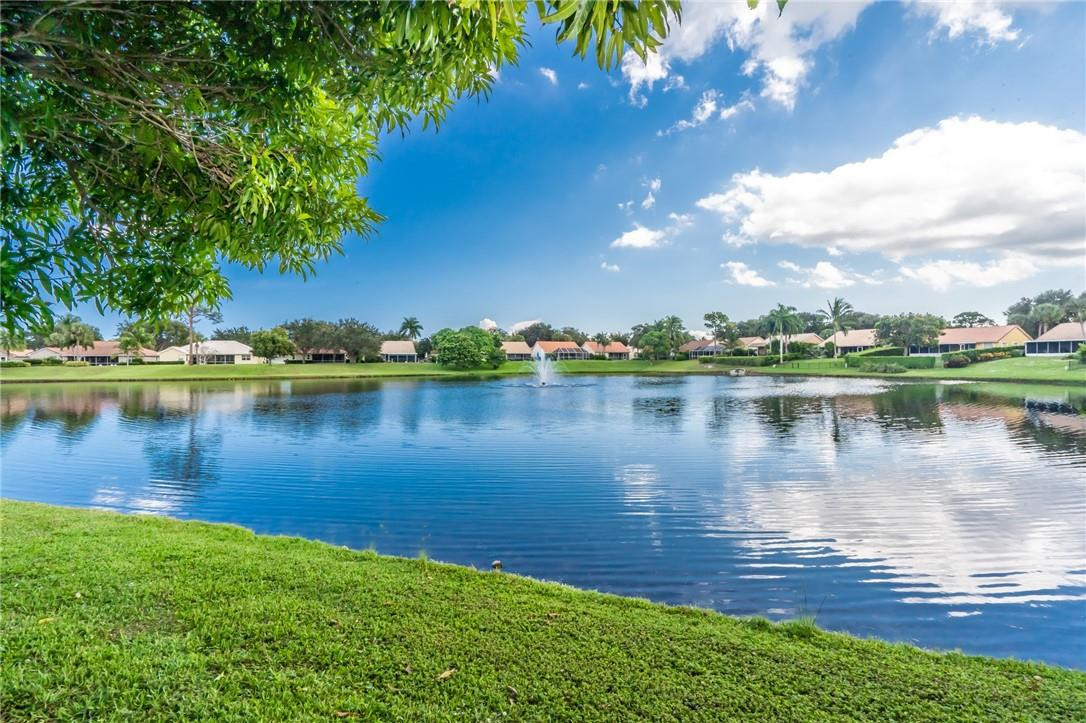 1315 Sabal Lakes Road Delray Beach, FL 33445 - Photo 38 of 38 a view of a lake with houses in the background