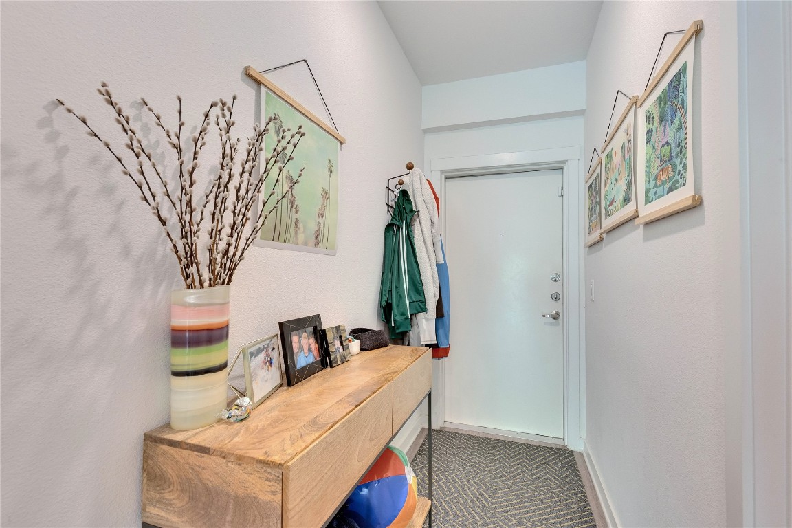 4361 South Congress Avenue, Unit 335 Austin, TX 78745 - Photo 15 of 22 a living room with furniture and a painting