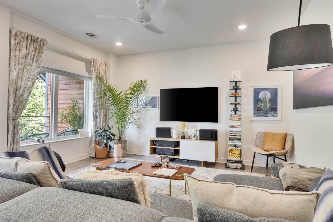 4361 South Congress Avenue, Unit 335 Austin, TX 78745 - Photo 2 of 22 a living room with furniture and a flat screen tv