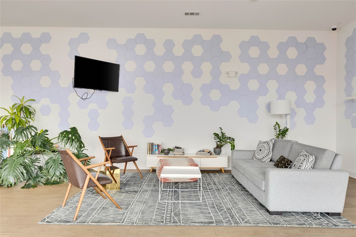 4361 South Congress Avenue, Unit 335 Austin, TX 78745 - Photo 22 of 22 a living room with furniture and a flat screen tv