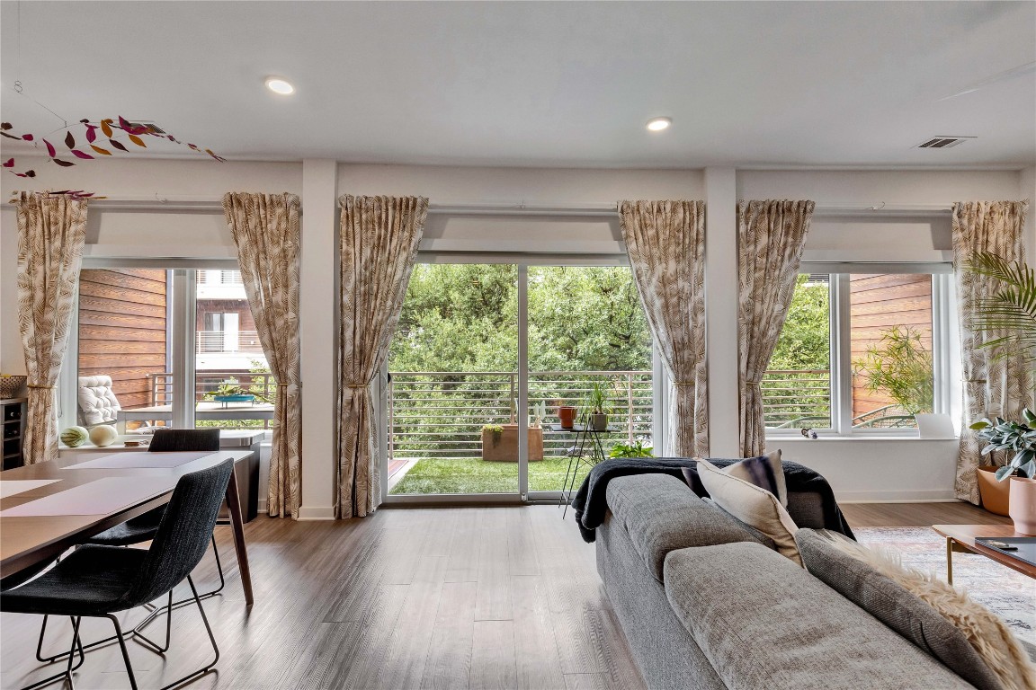 4361 South Congress Avenue, Unit 335 Austin, TX 78745 - Photo 7 of 22 a living room filled with furniture and a large window