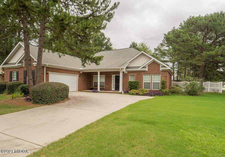 126 Timber Ridge Boulevard Byron, GA 31008 - Photo 2 of 26 a front view of a house with a garden
