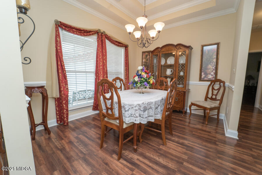 126 Timber Ridge Boulevard Byron, GA 31008 - Photo 11 of 26 a view of a dining room with furniture and wooden floor