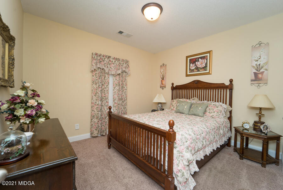 126 Timber Ridge Boulevard Byron, GA 31008 - Photo 16 of 26 a bedroom with a bed and a window