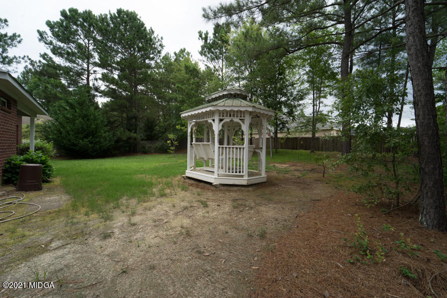 126 Timber Ridge Boulevard Byron, GA 31008 - Photo 20 of 26 a view of a house with backyard and garden