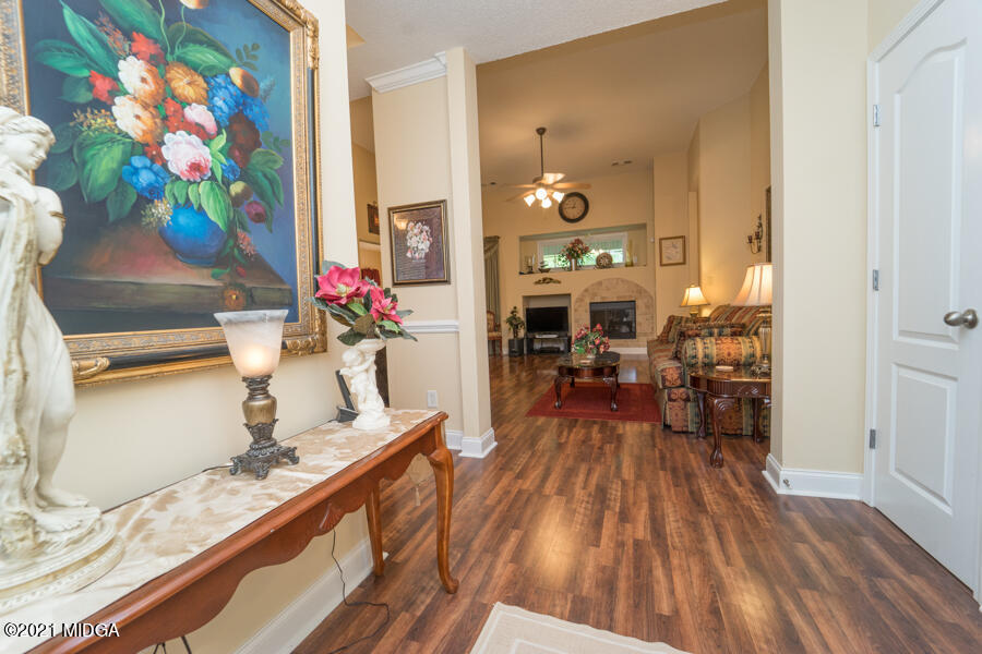 126 Timber Ridge Boulevard Byron, GA 31008 - Photo 26 of 26 a living room filled with furniture and a kitchen view