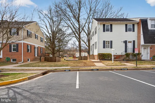 a view of entryway livingroom and hall with wooden floor