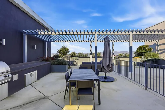 a view of a chairs and table in the patio
