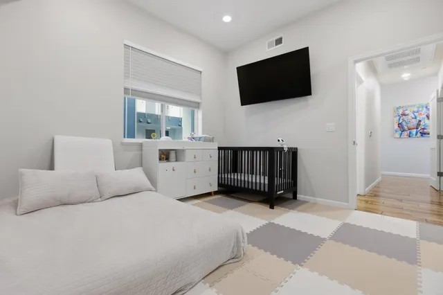 a living room with a flat screen tv and a couch