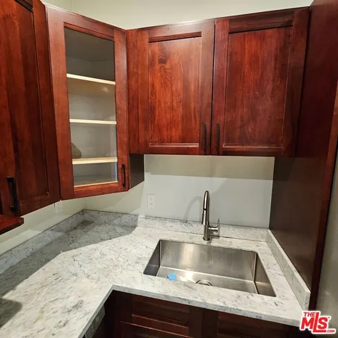 a view kitchen with granite countertop sink