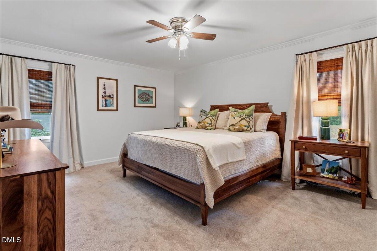 8604 Lobelia Street Raleigh, NC 27603 - Photo 20 of 27 a bedroom with a bed and a window