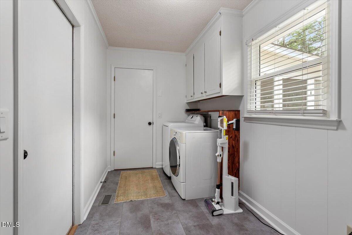 8604 Lobelia Street Raleigh, NC 27603 - Photo 25 of 27 a utility room with dryer and washer