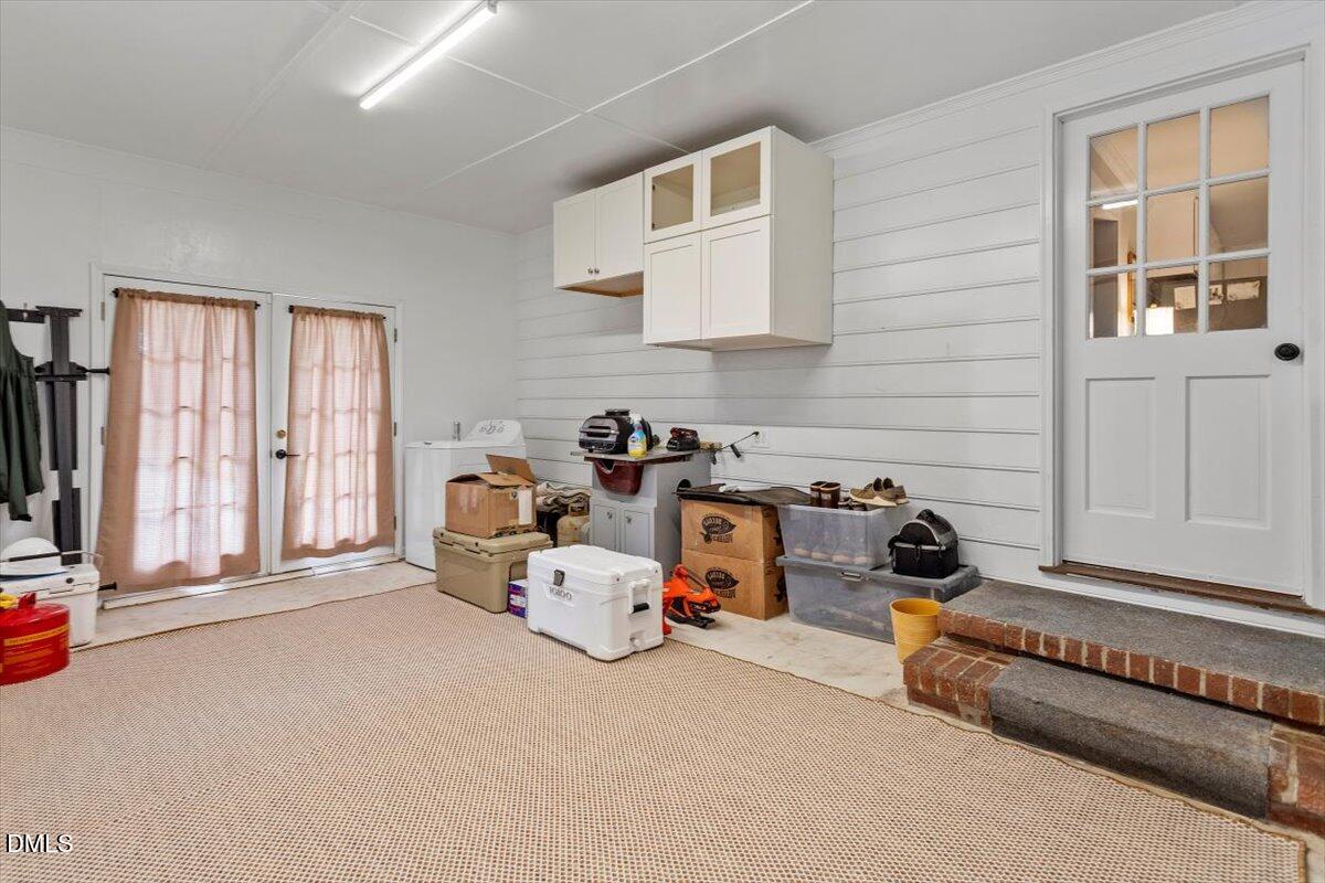 8604 Lobelia Street Raleigh, NC 27603 - Photo 26 of 27 a bed room with a bed and a large window