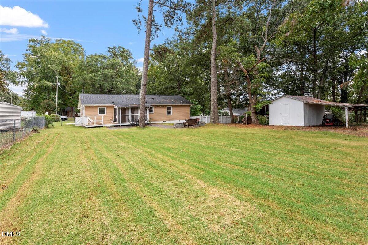 8604 Lobelia Street Raleigh, NC 27603 - Photo 3 of 27 a view of a house with a big yard
