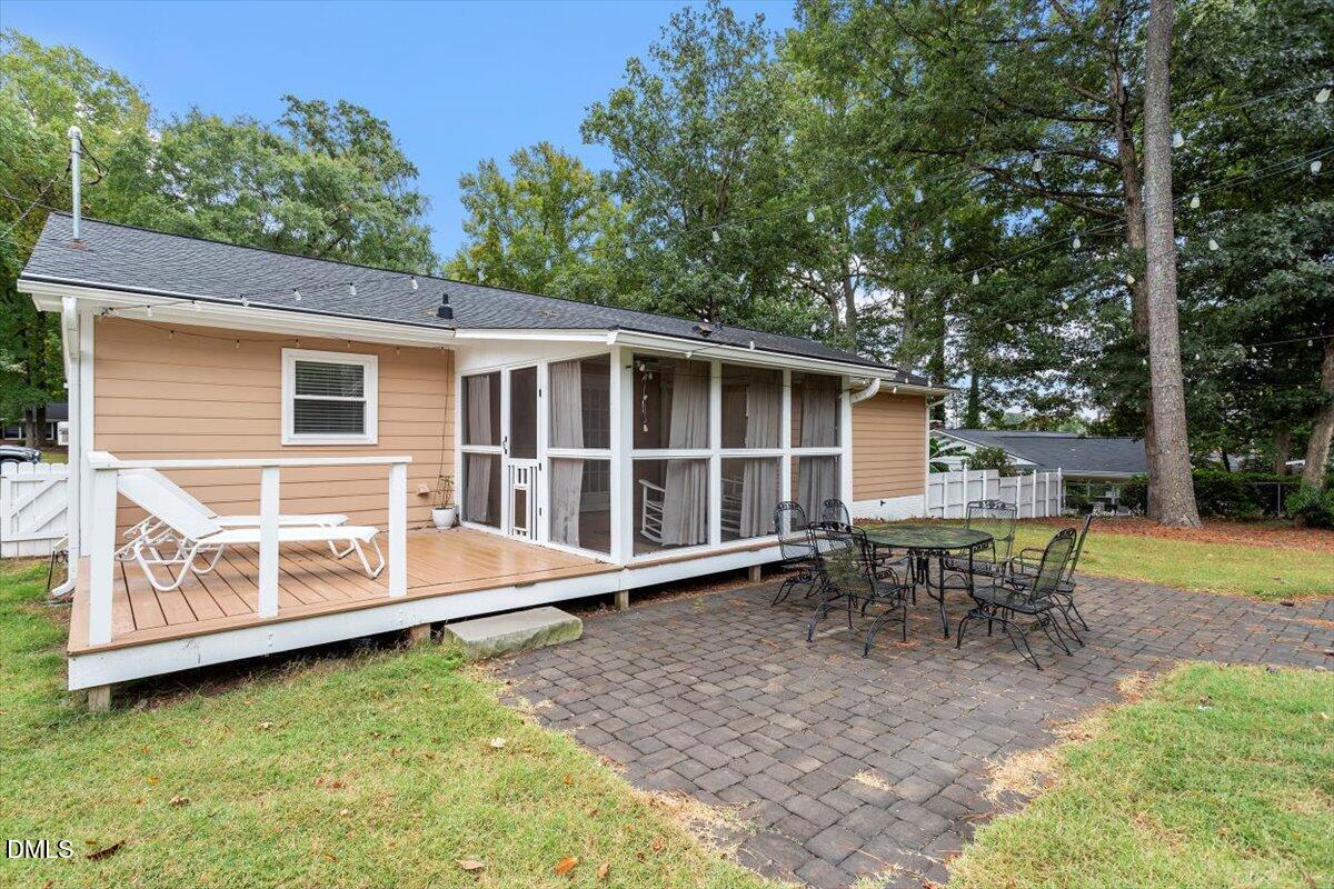 8604 Lobelia Street Raleigh, NC 27603 - Photo 6 of 27 a view of a house with backyard and sitting area