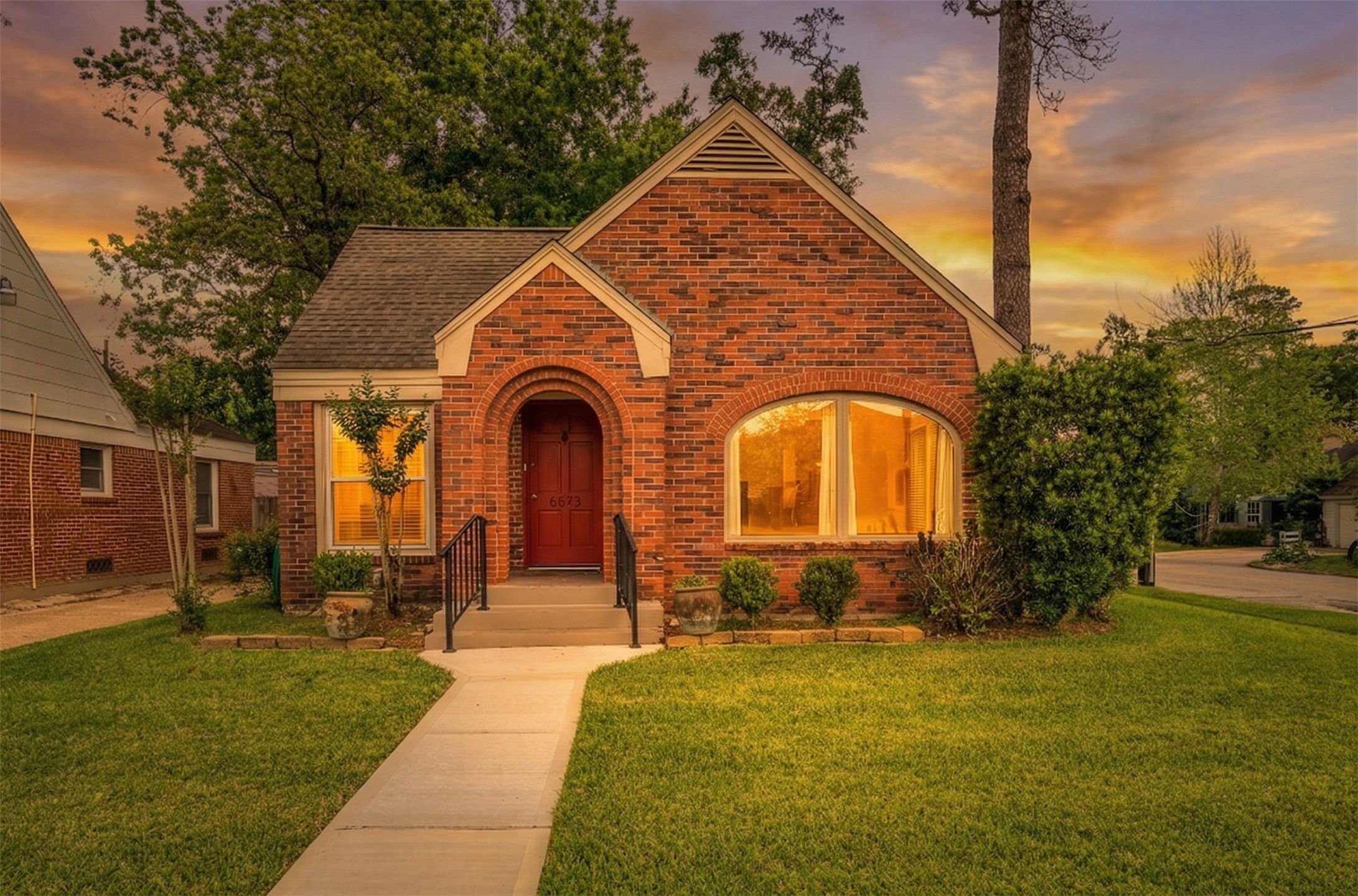 a front view of a house with garden